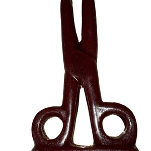 Brown scissors candle